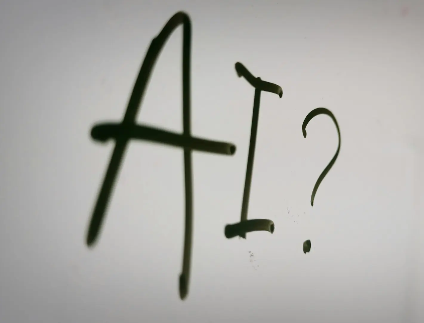 a sign with a question mark and a question mark drawn on it